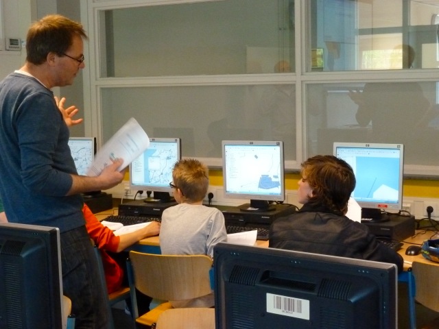 some kids in the class room doing QGIS